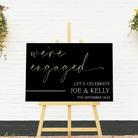 engagement welcome sign on black acrylic with gold lettering 