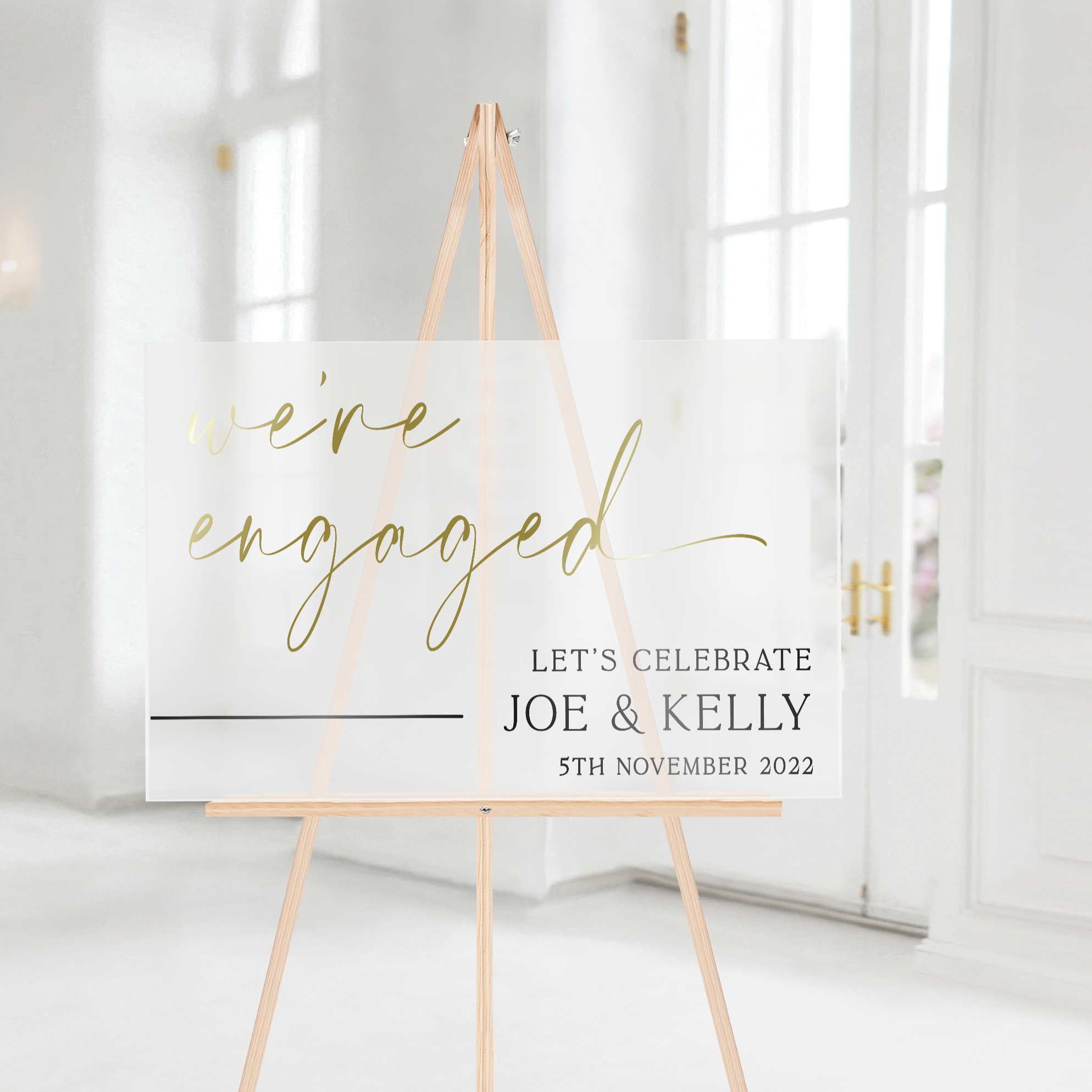 engagement welcome sign on frosted acrylic with gold lettering 
