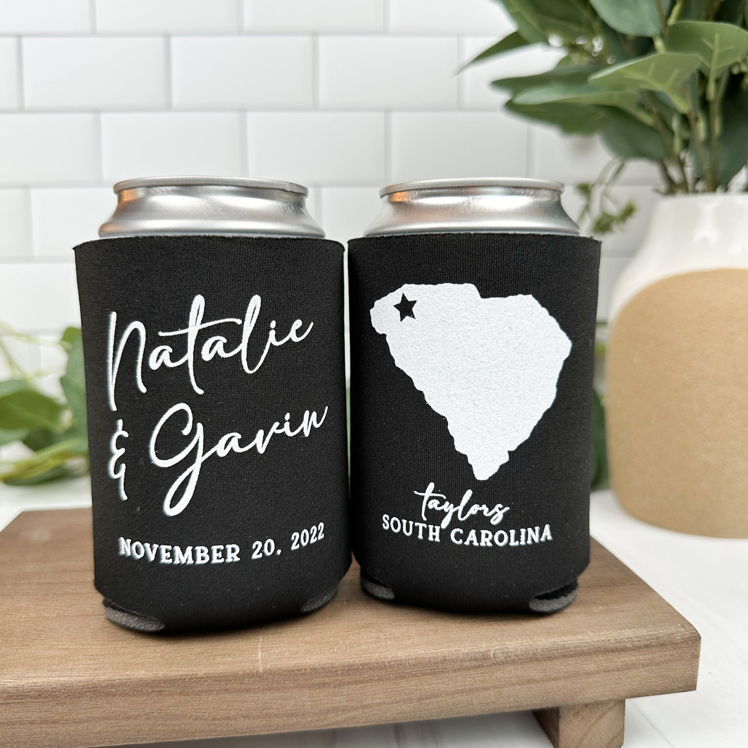 Custom wedding can coolers in the color black, featuring a state outline